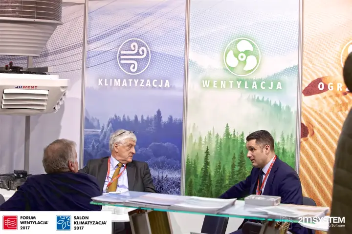 Meeting table at the Juwent stand in front of Klimatyzacja and Wentylacja panels