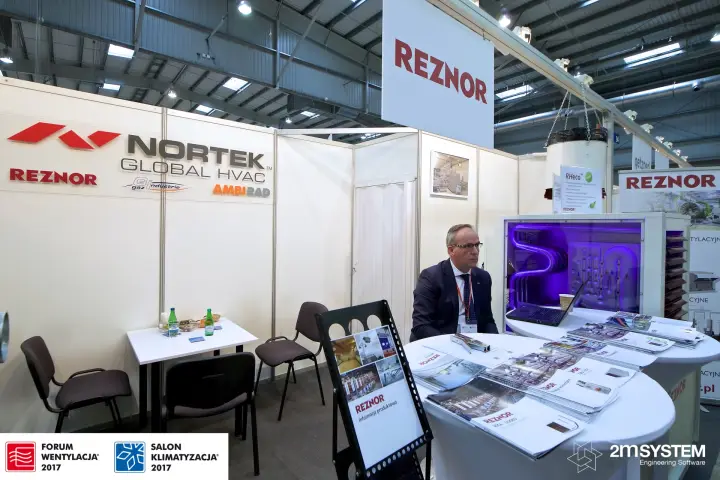 Reznor heater with exposed heat exchanger beside Nortek Global HVAC wall