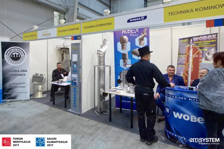 Row of chimney stands under 'Technika Kominowa' fascias with Wobex flue systems at Forum Wentylacja 2017