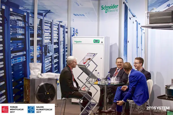 Schneider Electric stand with data-centre cooling cabinet and mural