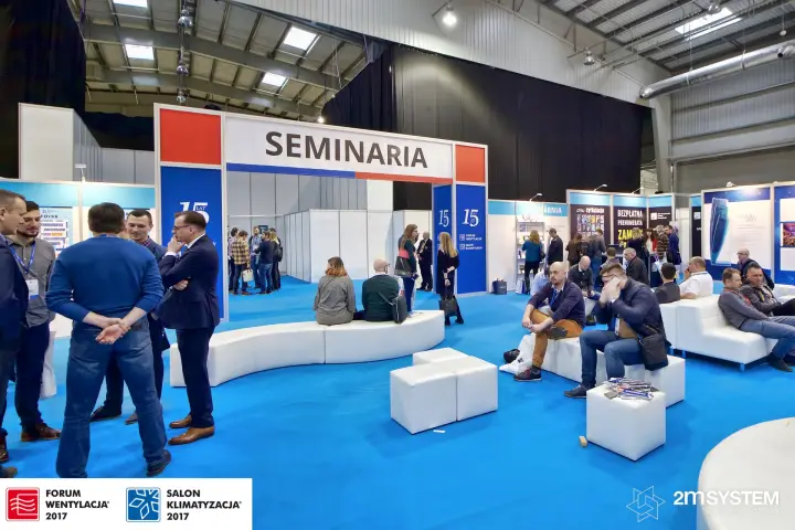 Seating area in front of the SEMINARIA gate with 15-year branding