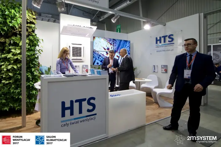 Staff at the HTS info desk with LG units and video wall at Forum Wentylacja 2017
