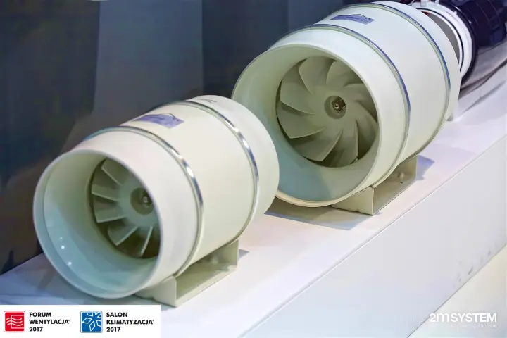 Two white mixed-flow inline duct fans on a display shelf