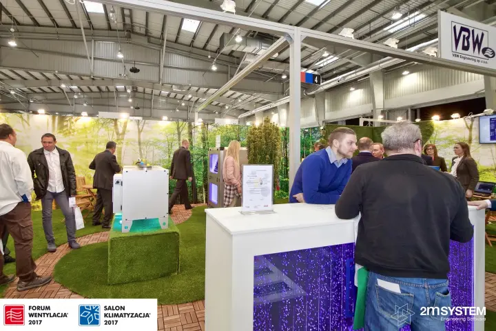 VBW reception counter with purple bubble lighting and garden backdrop at Forum Wentylacja 2017