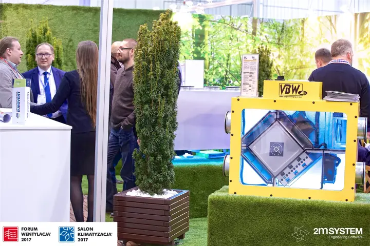 VBW stand with yellow heat recovery unit and potted yew trees at Forum Wentylacja 2017