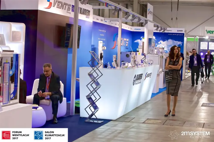 Vents and Blauberg stand with glowing counter and white lounge seating at Forum Wentylacja 2017