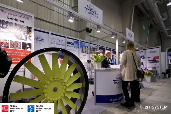 Venture Industries stand with a yellow-bladed axial fan in front at Forum Wentylacja 2017