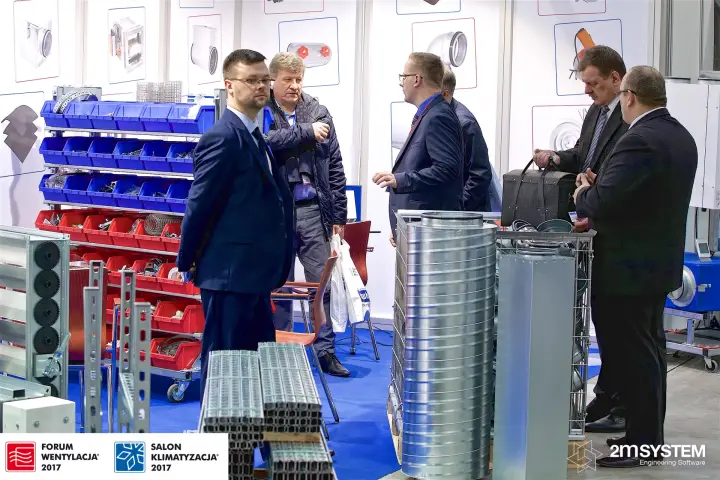 Visitors among spiral ducts, mounting rails and fittings racks