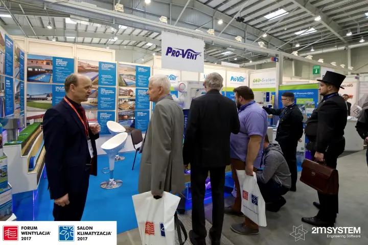 Visitors crowd the Pro-Vent stand with reference project panels