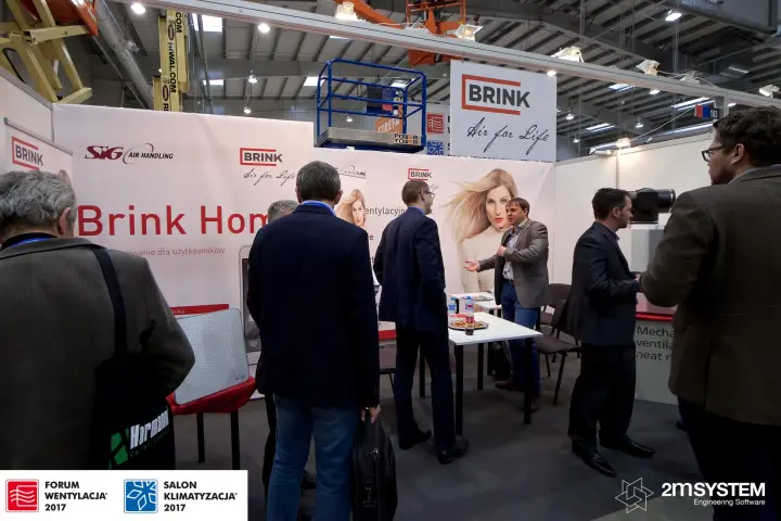 Visitors crowding the Brink stand with 'Brink Home' graphics