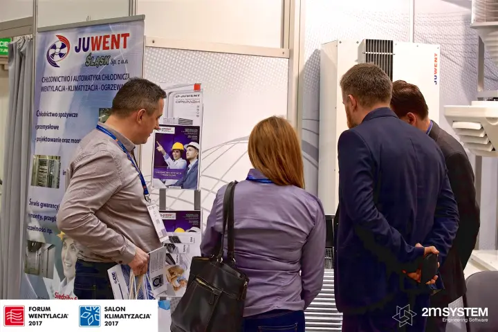 Visitors at Juwent Śląsk leaflet rack and unit display