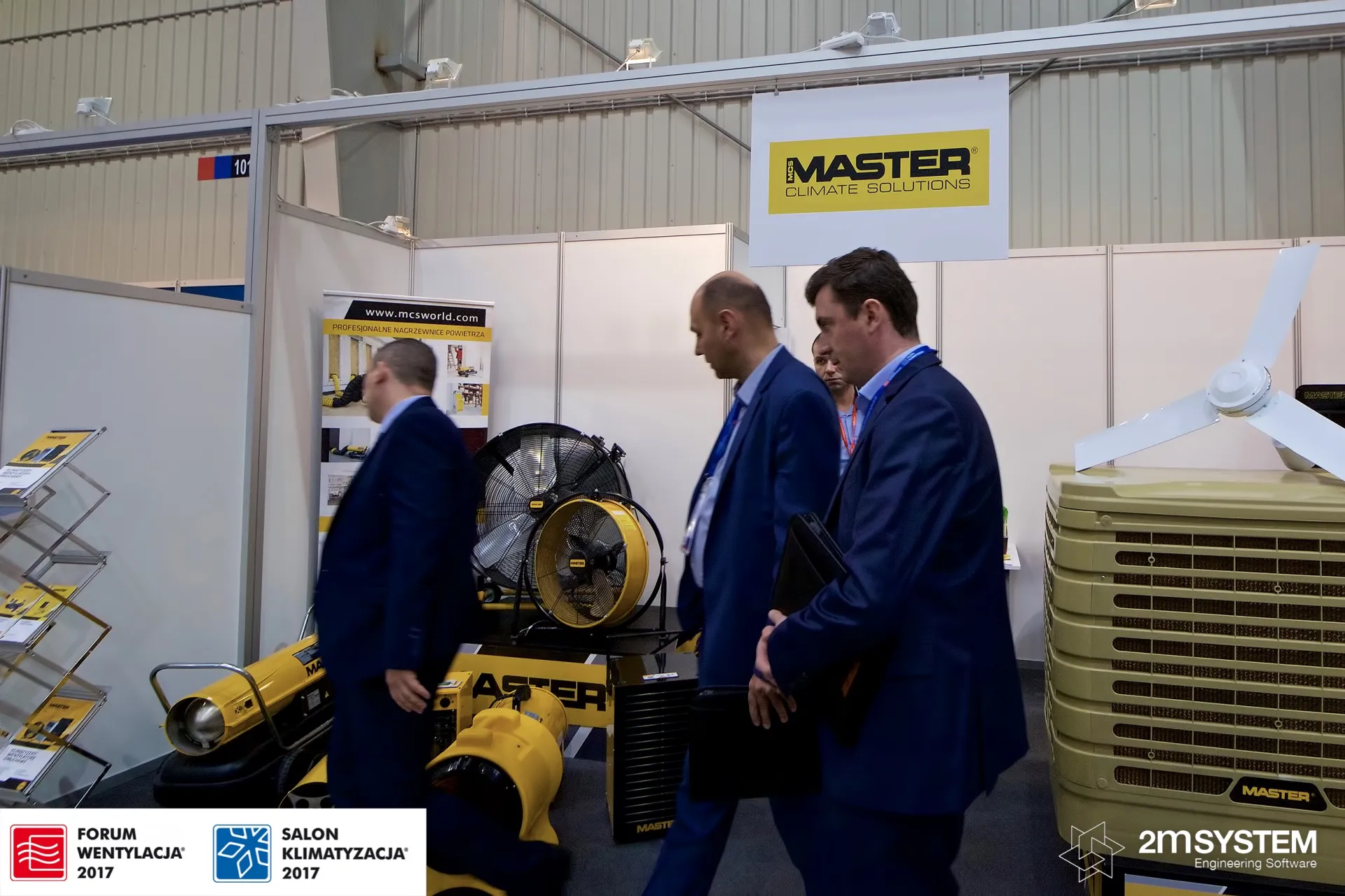 Visitors pass Master heaters and a large evaporative cooler at Forum Wentylacja 2017