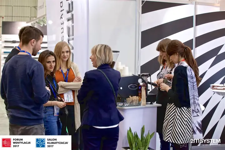 Visitors waiting at the Planetfan coffee bar, stand no. 21