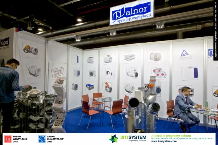 Alnor duct fittings display and meeting tables under the illuminated logo at Forum Wentylacja 2019