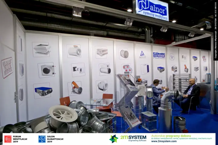 Alnor stand wall of product graphics with galvanised duct fittings in front at Forum Wentylacja 2019