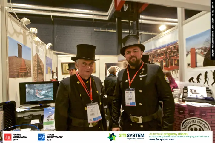 Chimney sweeps in traditional uniforms at the chimney guild stand at Forum Wentylacja 2019