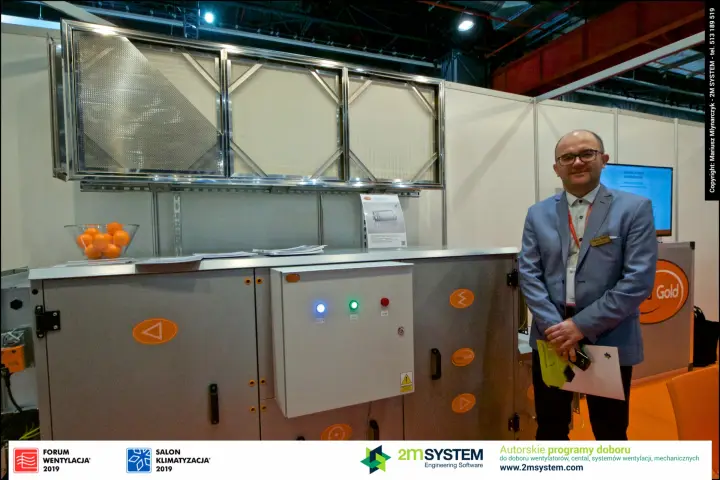 Clima Gold representative beside the company's air handling unit