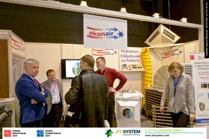 Ekonair evaporative coolers stand with yellow flexible duct and visitors