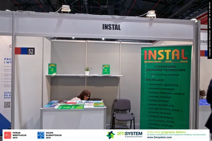 INSTAL technical journal stand 52 with green roll-up and magazine copies