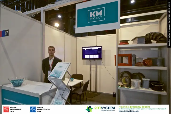 KM Project stand 57 with flexible duct connectors and teal counter