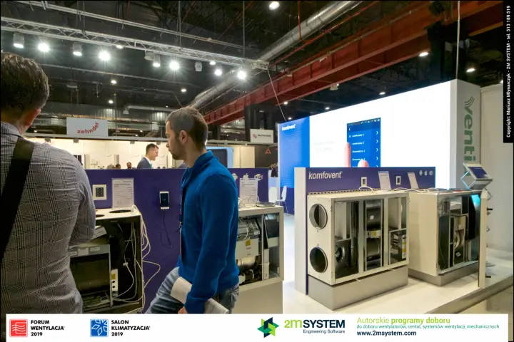 Komfovent heat recovery units with open panels and app on LED wall