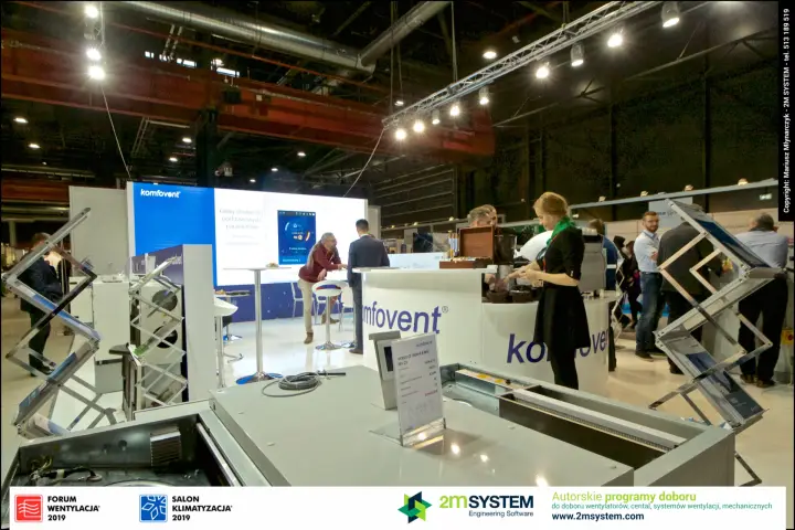 Komfovent stand with VERSO unit and LED wall showing controller