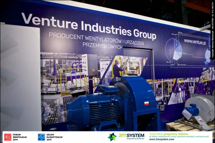 Large blue industrial centrifugal fan under the Venture Industries Group sign
