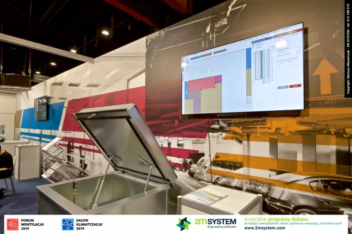 Open galvanised smoke hatch below a floor-plan software screen