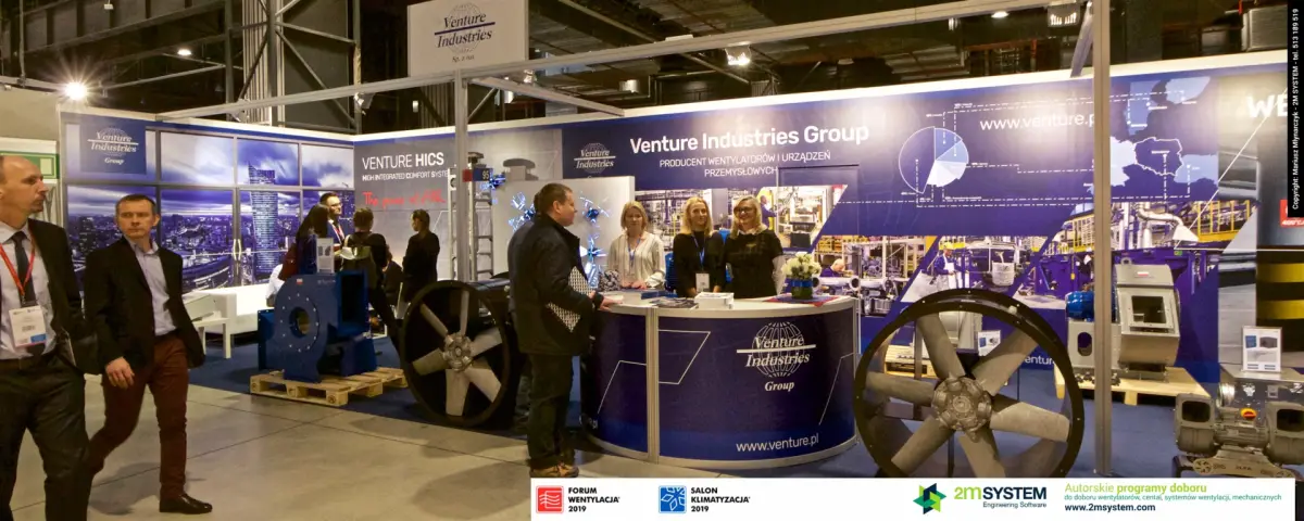 Panorama of Venture Industries stand with axial fans flanking the counter at Forum Wentylacja 2019