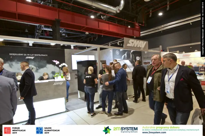 SMAY stand seen from the aisle with reception desk and display tower at Forum Wentylacja 2019