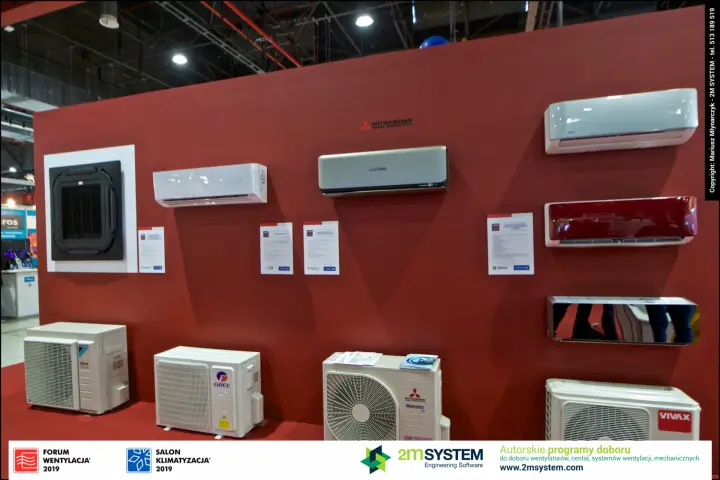 Split AC indoor units and outdoor condensers on a red wall, Vivax unit right at Forum Wentylacja 2019
