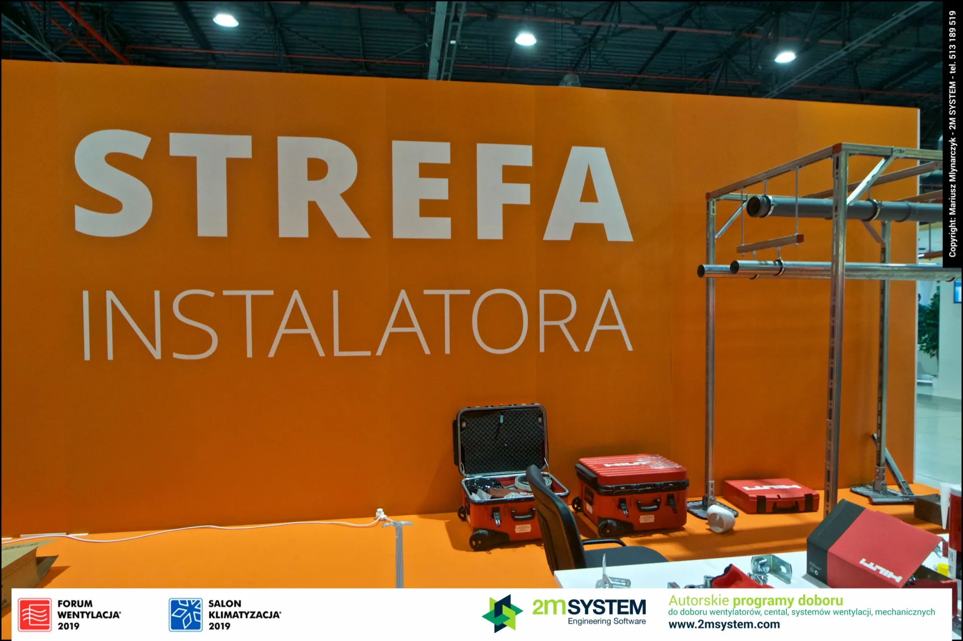 Strefa Instalatora orange wall with Hilti tool cases and pipe frame at Forum Wentylacja 2019