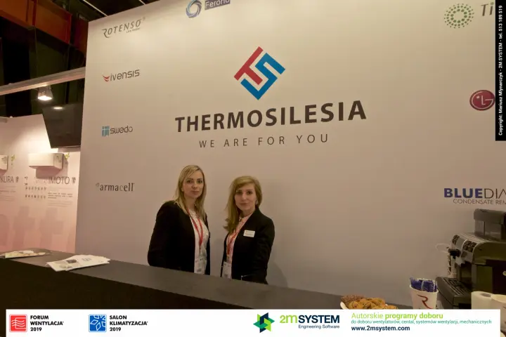 Thermosilesia reception counter with partner brand logos behind