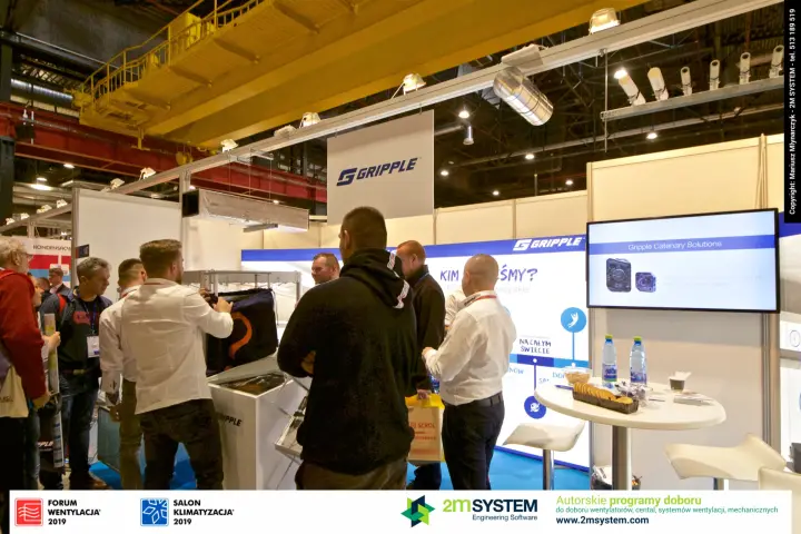 Visitors crowd the Gripple stand with Catenary Solutions on screen