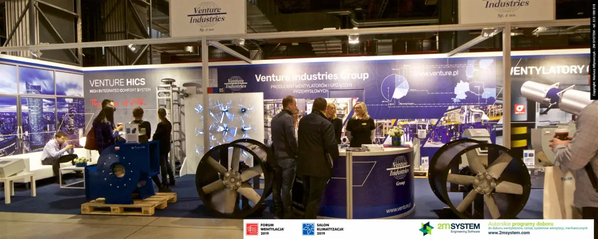 Visitors crowd the Venture Industries counter between two axial fans at Forum Wentylacja 2019