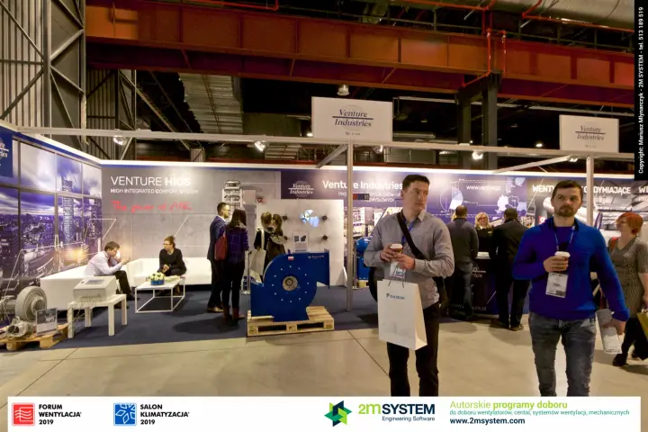 Visitors walk past the Venture Industries stand in the aisle at Forum Wentylacja 2019