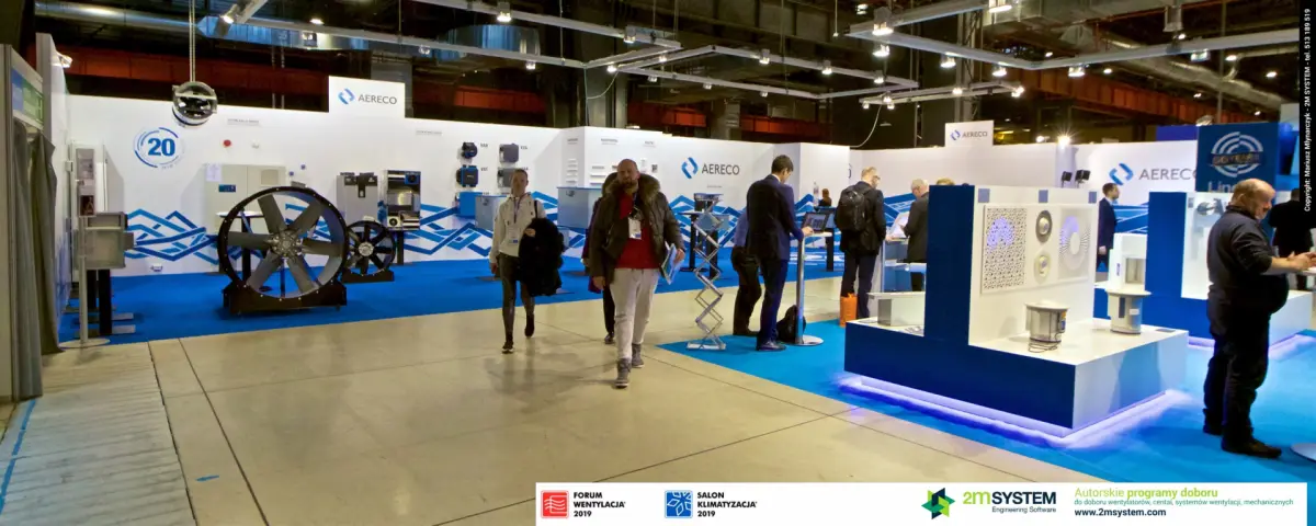 Visitors walking past the Aereco stand and TROX displays at Forum Wentylacja 2019