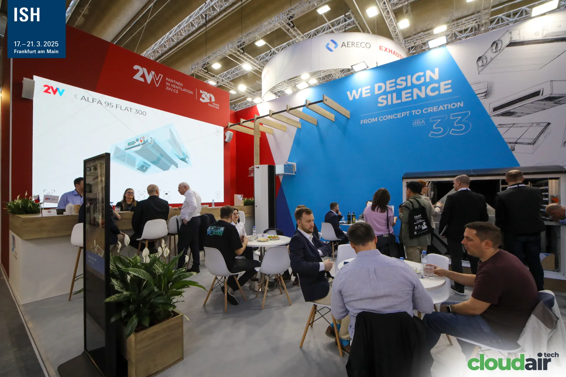 2VV stand with "We Design Silence" wall and crowded meeting area at ISH 2025