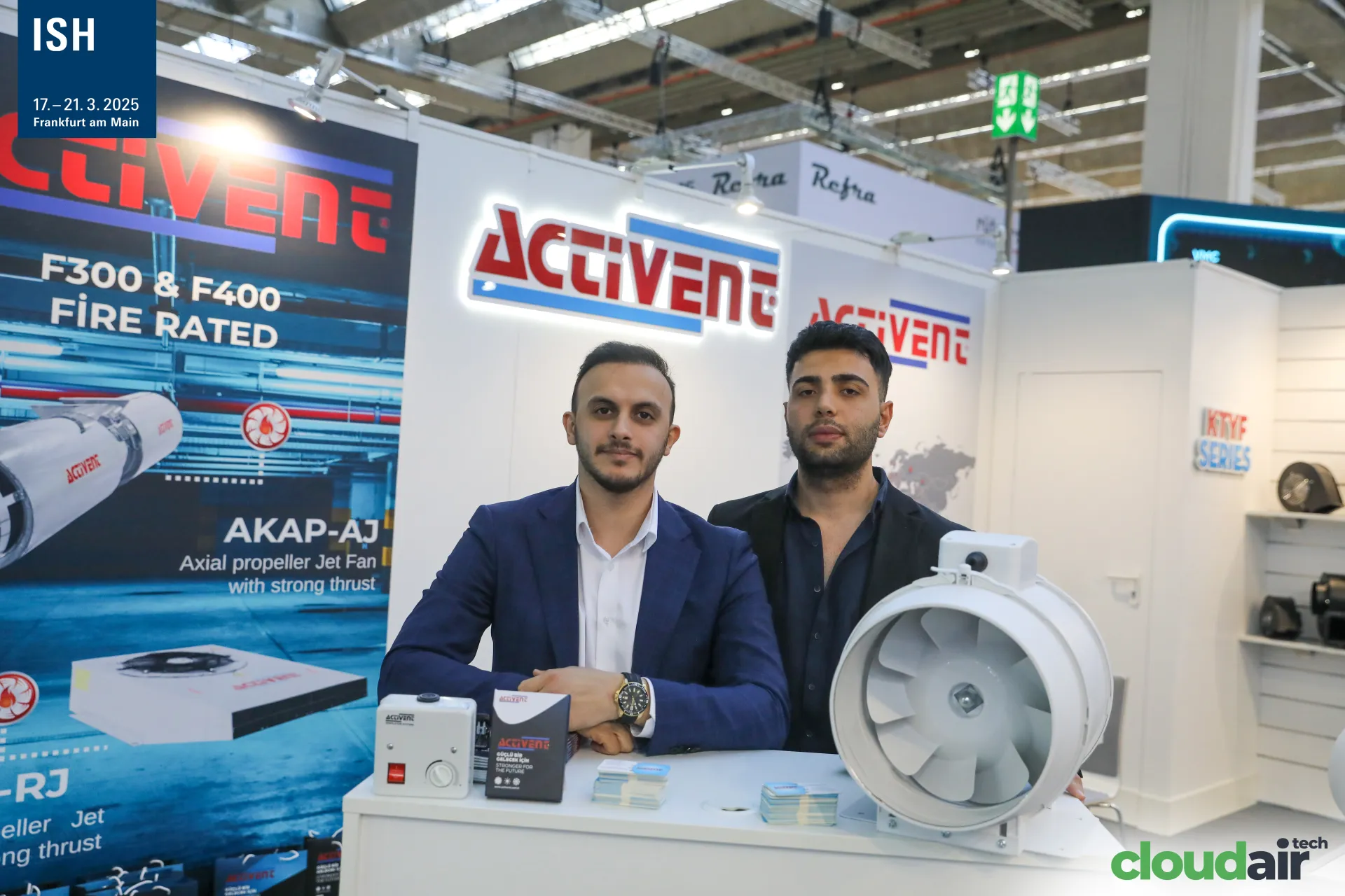 Activent team with an inline mixed-flow duct fan and speed controller at ISH 2025