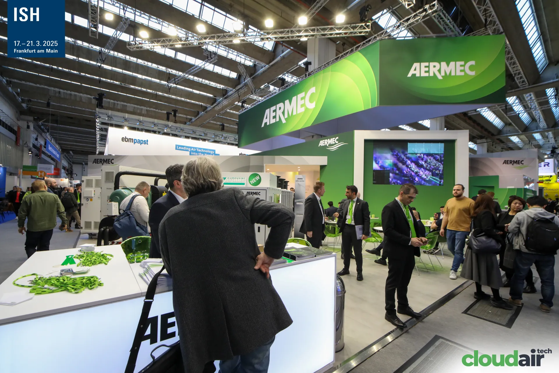 Aermec info counter with green lanyards and chillers marked 'New' at ISH 2025