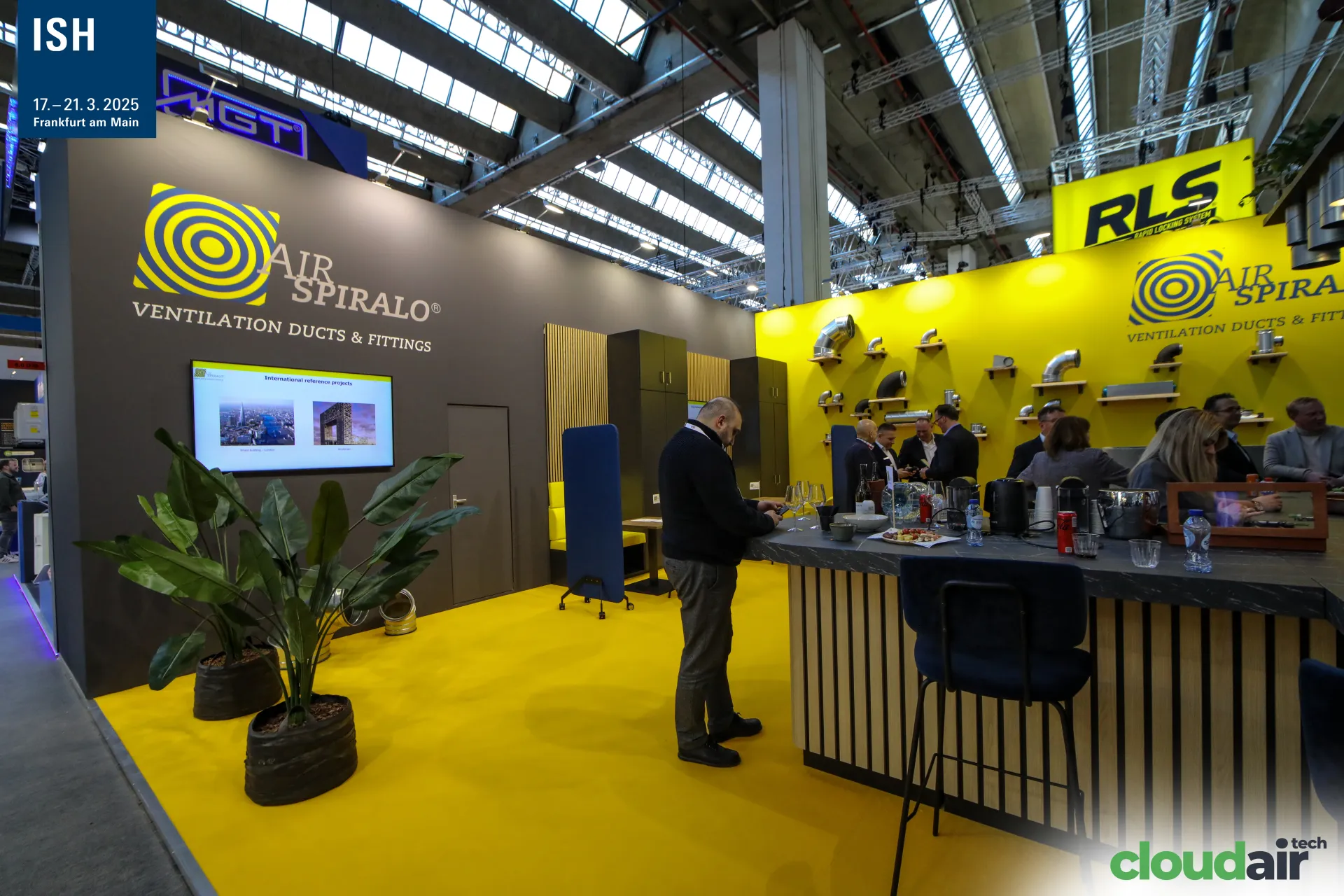 Air Spiralo ducts and fittings on yellow wall with stand bar at ISH 2025