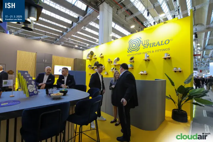 Air Spiralo yellow wall of duct fittings and bar counter at ISH 2025
