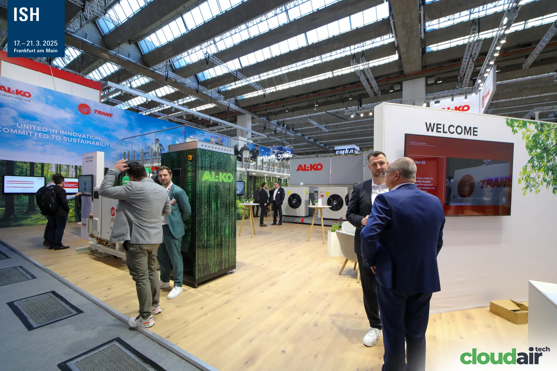 AL-KO cabinet with green code graphics and a Trane welcome wall at ISH 2025