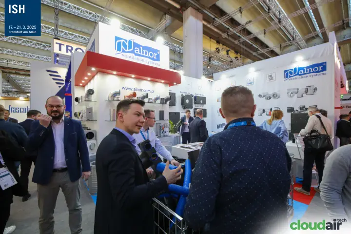 Alnor staff presenting blue flexible ducting to visitors