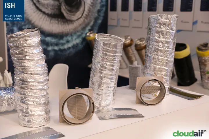 Aluminium flexible ducts and plastic backdraft dampers on a display table