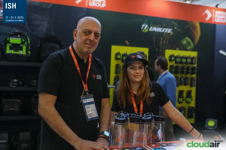 Aspen Pumps Group staff at a counter with branded bottles