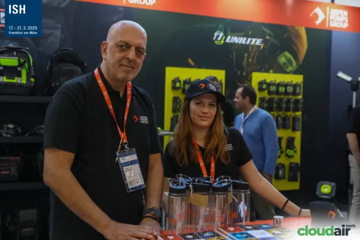 Aspen Pumps Group team portrait with Unilite lights display