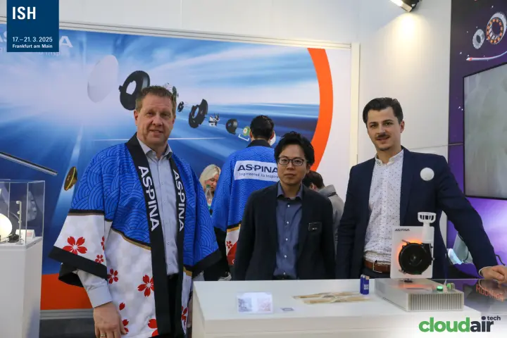 Aspina group photo with motor component artwork behind at ISH 2025