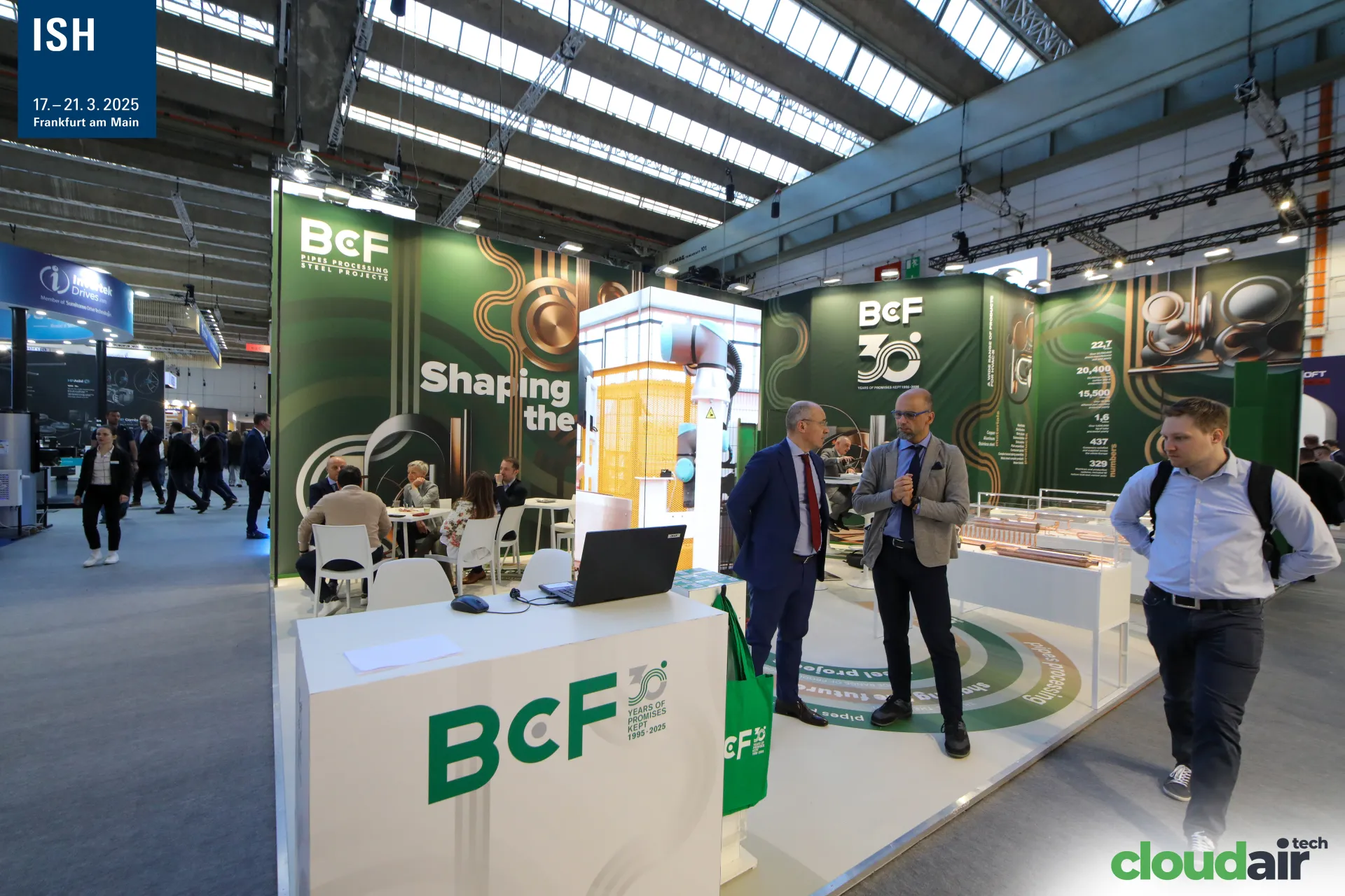 BcF stand marking 30 years with copper pipe displays and robot cell at ISH 2025