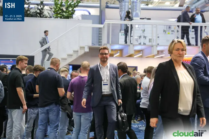 Busy bar area on a two-level stand with AHU on the upper deck at ISH 2025